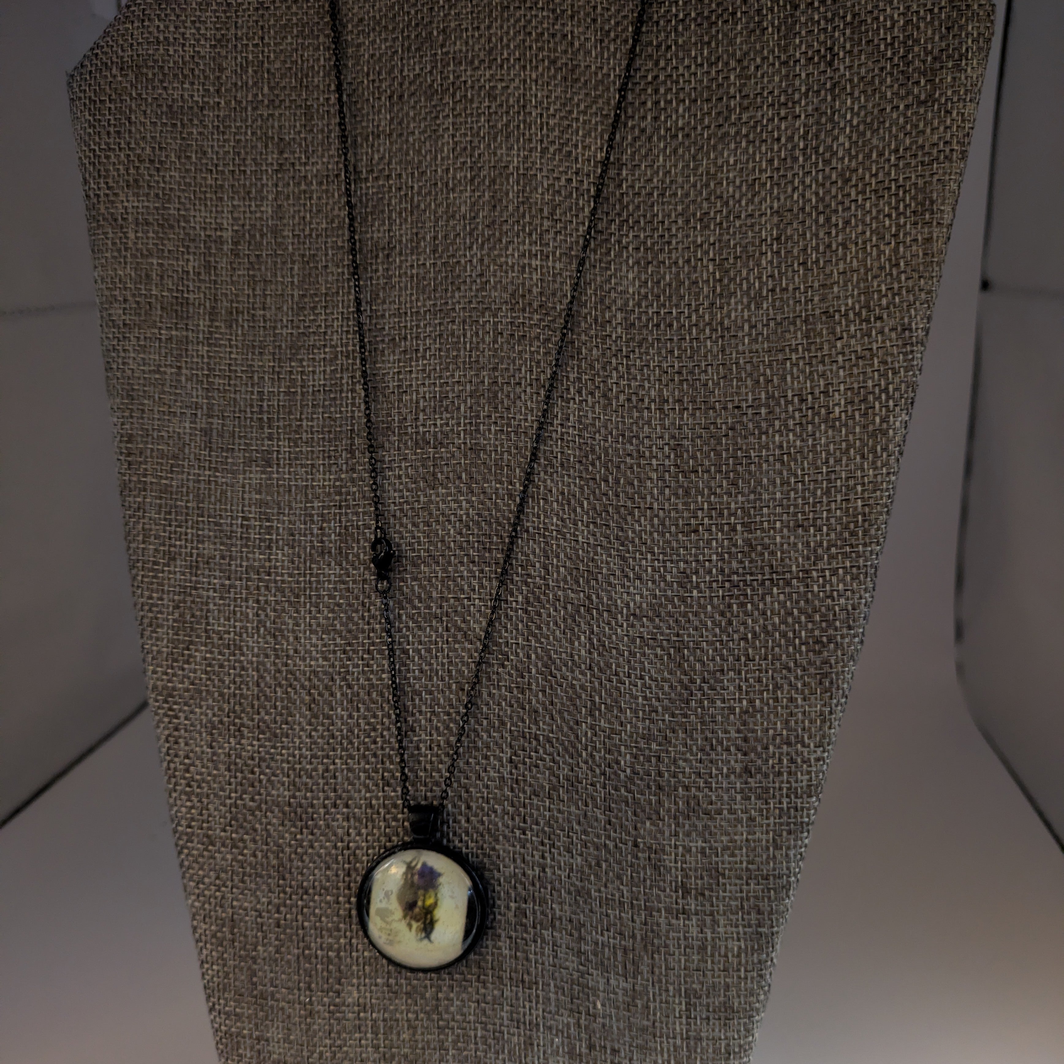 T.K. Human Heart Dome Necklace with Black enameled metal hardware.